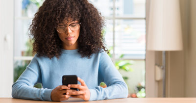 black woman, phone, friends