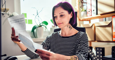 purple hair, stripes, shirt, black and white, tattoo, neck tattoo, woman, credit score, paper